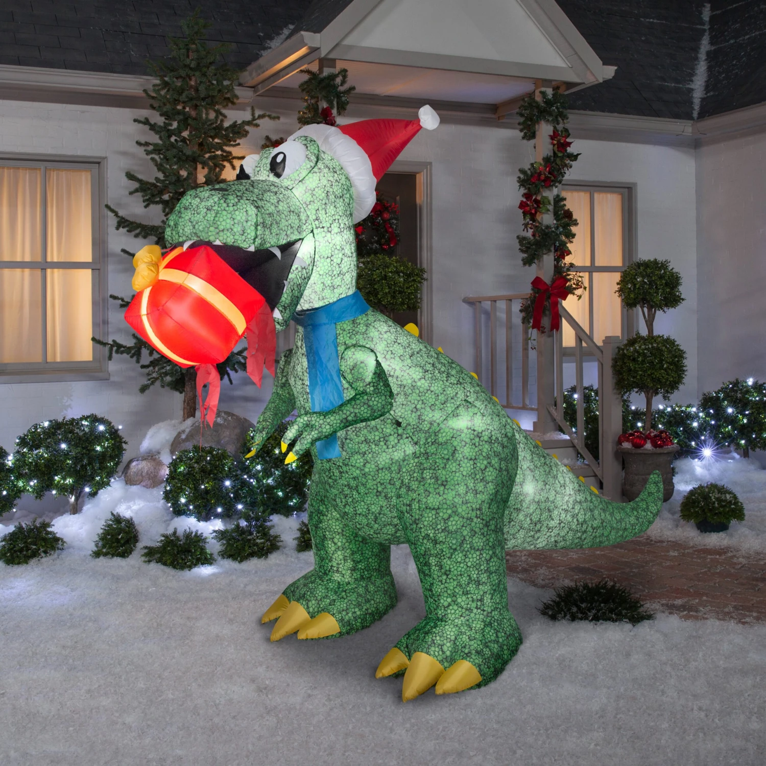 National Tree Company Inflatable Tyrannosaurus Rex With Gift, LED Lights, Plug In, Christmas Collection, 9.5 Feet 2 National Tree Company Inflatable Tyrannosaurus Rex With Gift, LED Lights, Plug In, Christmas Collection, 9.5 Feet - Image 2