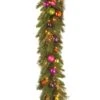 National Tree Company Pre-Lit Artificial Christmas Garland, Green, Kaleidoscope, White Lights, Decorated With Ball Ornaments, Berry Clusters, Plug In, Christmas Collection, 6 Feet